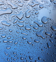 The Rain drops on a metal surface