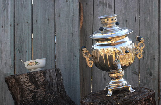 Old samovar on stump and bowl