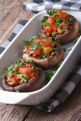 stuffed portobello mushrooms in a baking dish