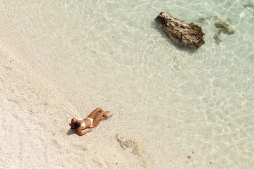 Summer vacation woman on beach enjoying summer holidays looking