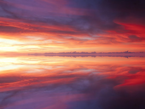 Reflection of dramatic and colorful clouds