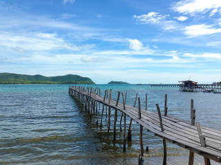 crystal clear water with the old bridge at the sea