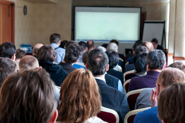 people sitting rear at the business conference