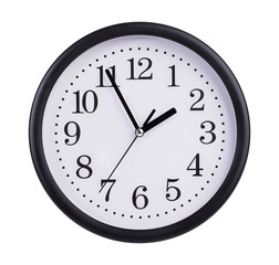 Office clock shows five minutes to two