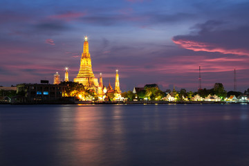 The beautiful temple along the Chao Phraya river at twilight