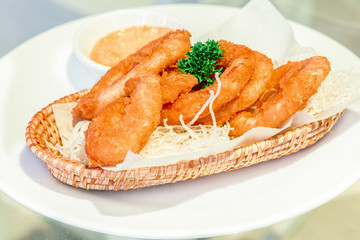 Onion rings with ketchup on the table