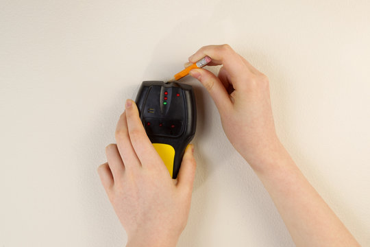 Using Stud Finder On Interior Home Wall