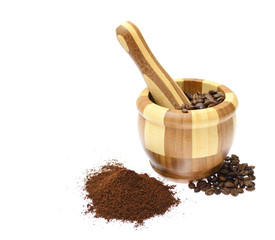 The mortar , coffee beans isolated on white background.