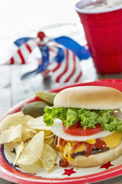 Loaded cheeseburger at a patriotic themed BBQ