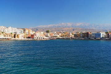 Fototapeta na wymiar View of the old port of Chania and mountains, Crete