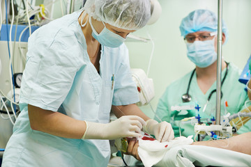 surgeons producing general anaesthesia in surgery