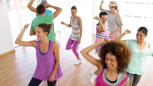 Zumba class dancing in studio