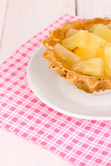 sweet cake with fruits on wooden background
