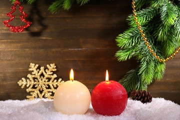 Burning candles on wooden background