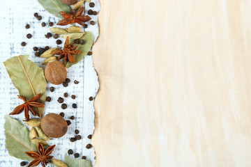 Herbs and spices border, on wooden background