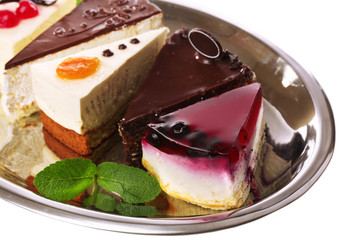 Assortment of pieces of cake, isolated on white © Africa Studio