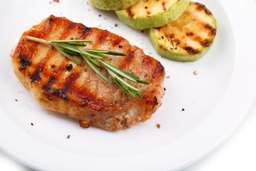 Grilled steak and grilled vegetables isolated on white
