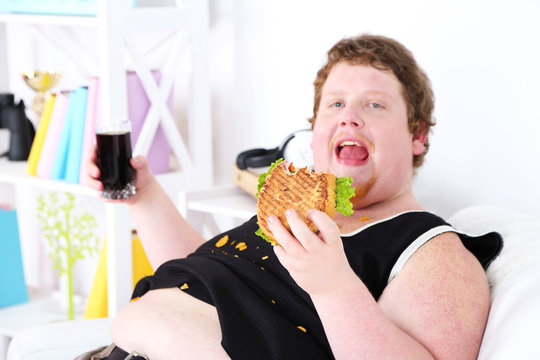 Fat Man Eating Tasty Sandwich And Drink Coke