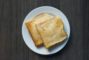 Slices of toast on wood table