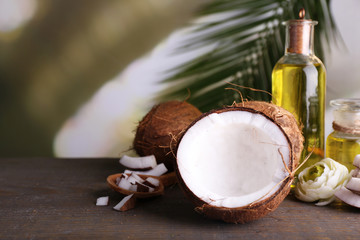 Coconuts and coconut oil on wooden table