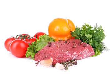 Raw beef meat with vegetables and spices isolated on white