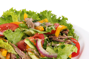 Beef salad on plate isolated on white