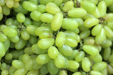 Fresh grapes on green banana leaves