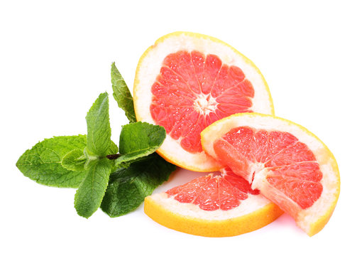 Grapefruit fruit with mint isolated on white