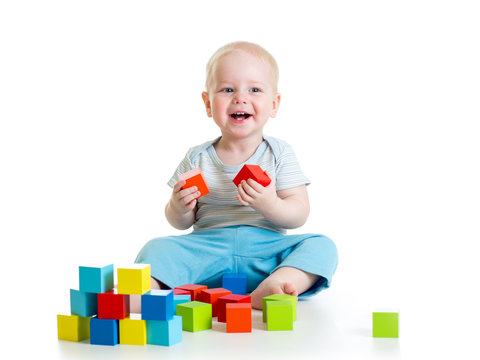 kid boy playing  wooden toys