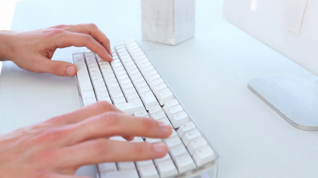 Businessman typing on keyboard