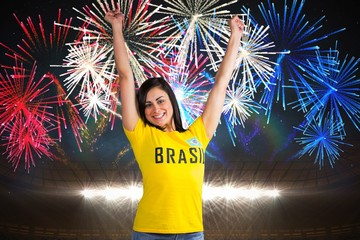 Fototapeta na wymiar Excited football fan in brasil tshirt