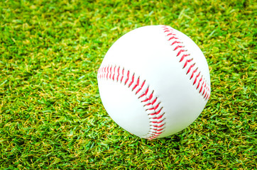 Baseball on green grass