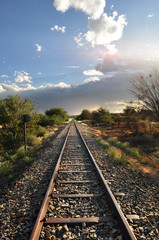 Old railway through African arid landscape