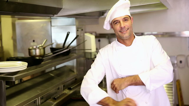 Handsome chef making ok sign to camera