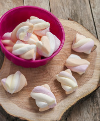 Marshmallows close up on wooden background
