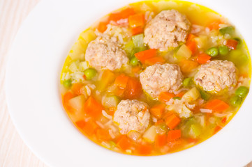 Soup with meatballs, rice and vegetables