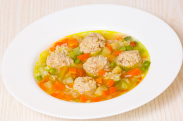Soup with meatballs, rice and vegetables