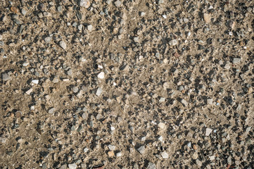 Dried soil with pebbles texture