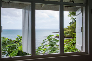 View of Tropical Sea Through Old Wood Window