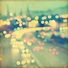 Blurred cityscape background with bokeh effect. Grunge and retro