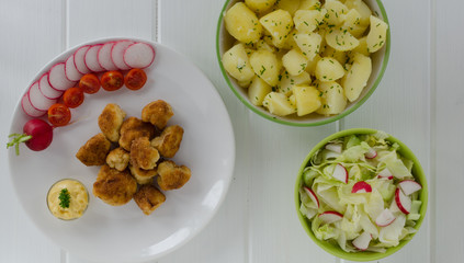 Fried cauliflower, potatoes and salad