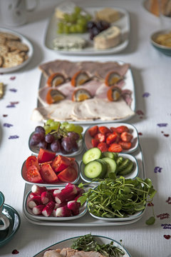 Radishes and watercress on table with other buffet ingredients.