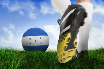 Football boot kicking honduras ball