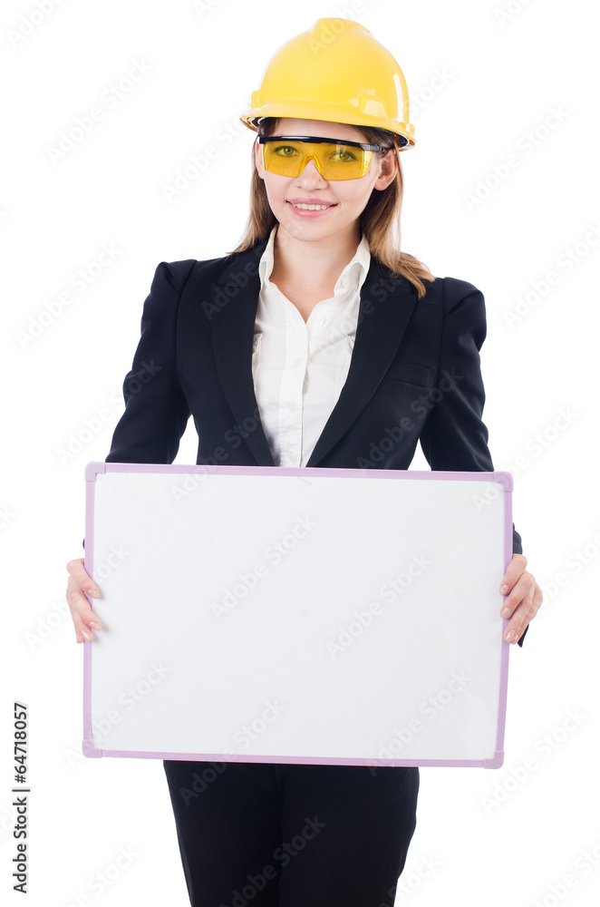 Wall mural pretty businesswoman with hard hat and blank board isolated on