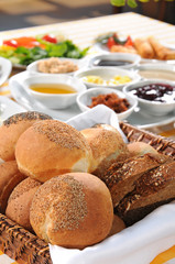 Bread basket on tasty breakfast table