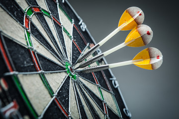 Three darts in the target center