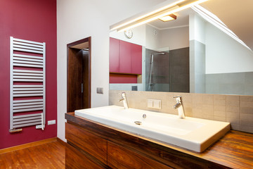 Double washbasin on wooden counter