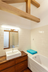White sink on wooden cupboard