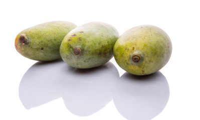 Green mango fruit over white background