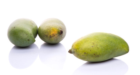 Green mango fruit over white background
